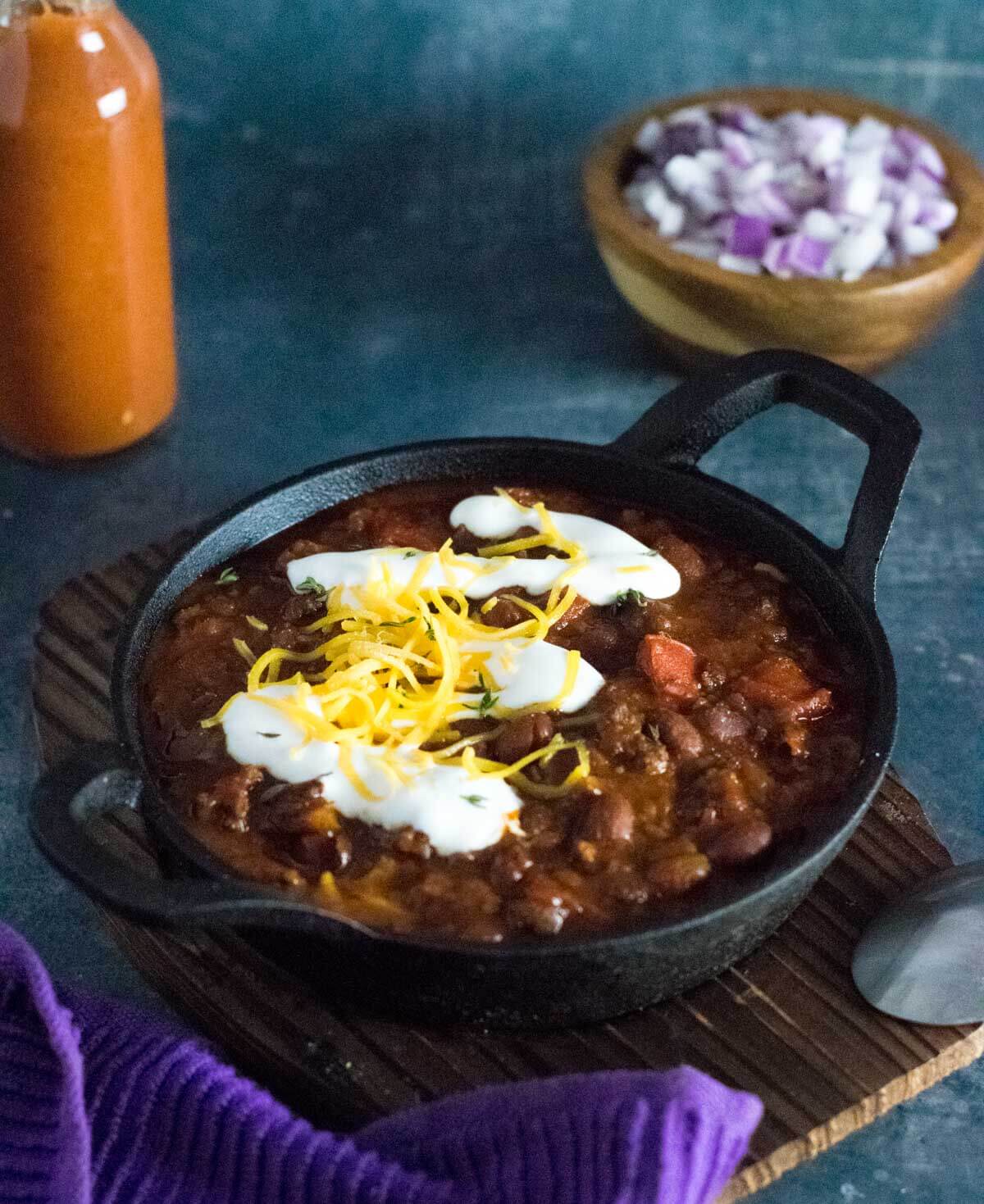 Serving chorizo chili with toppings.