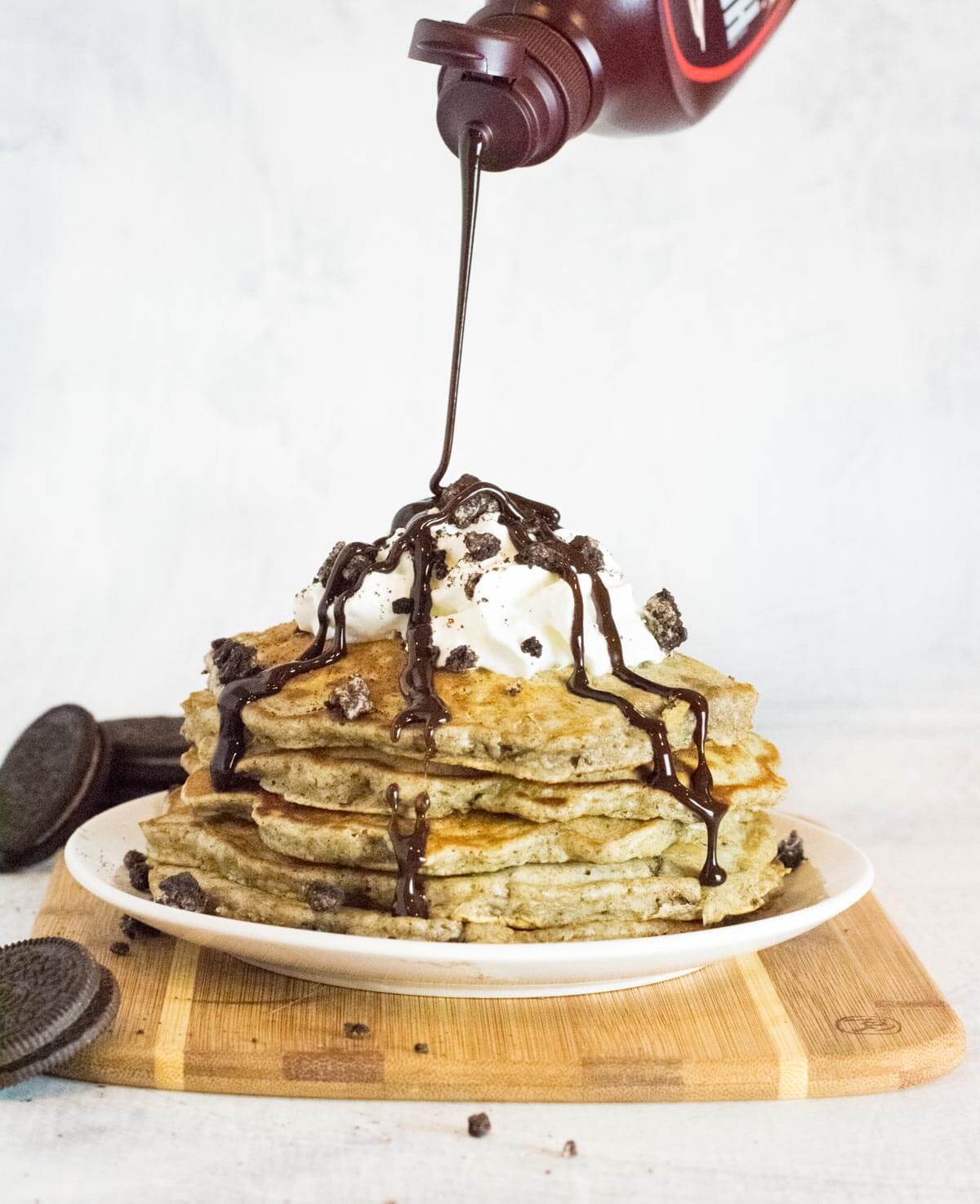 Oreo pancakes with chocolate syrup.