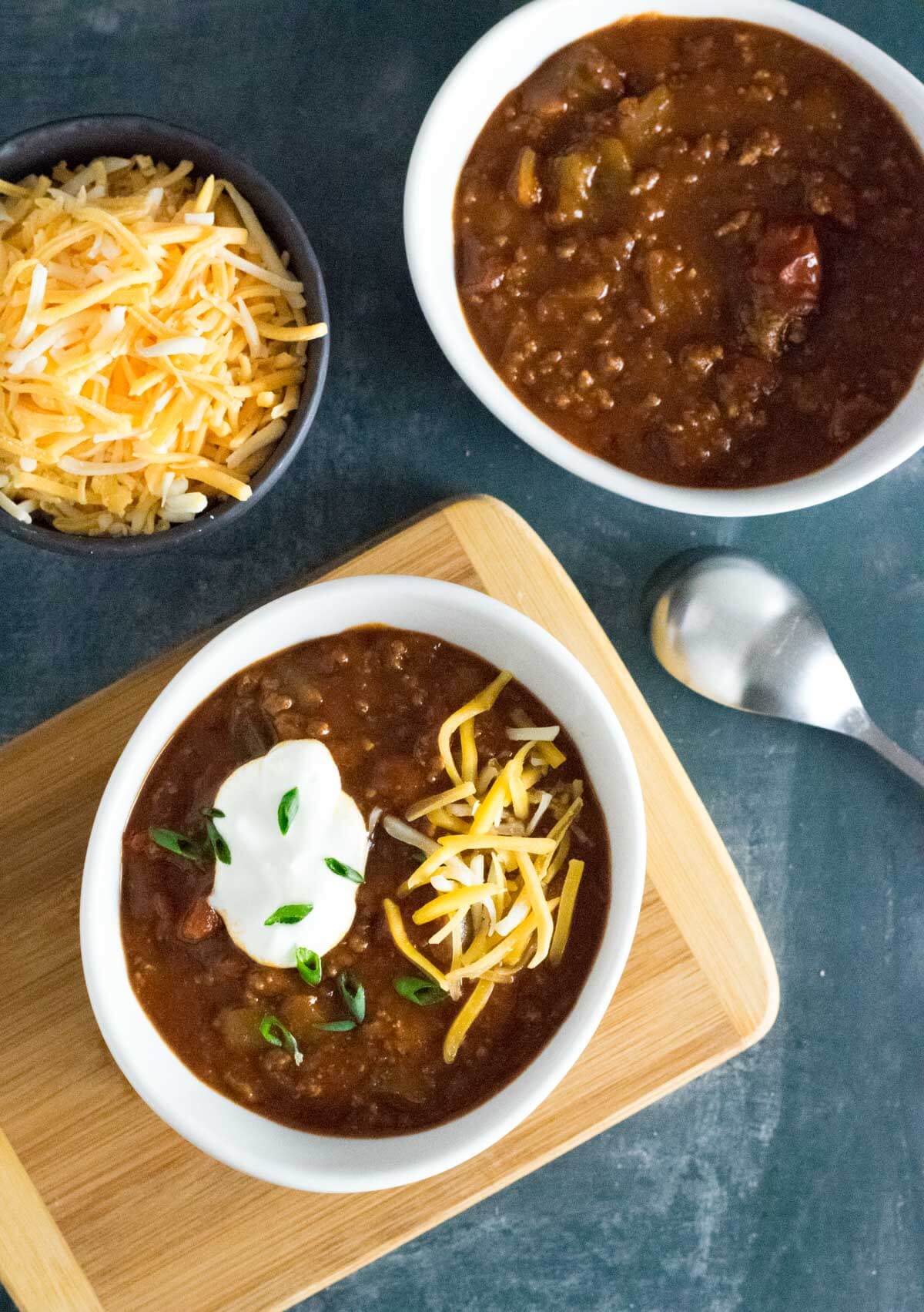 Serving no bean chili with toppings.