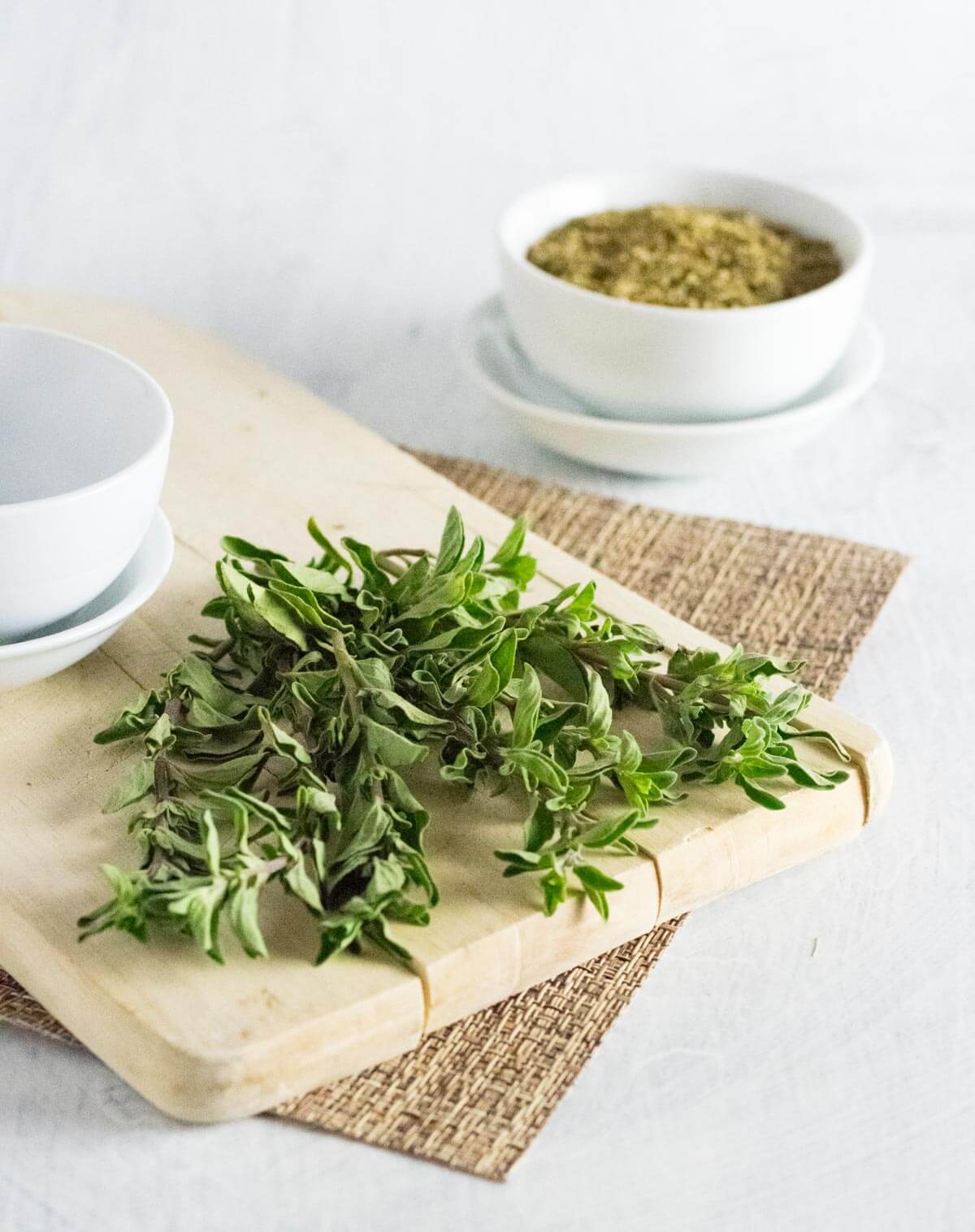 Drying fresh oregano.