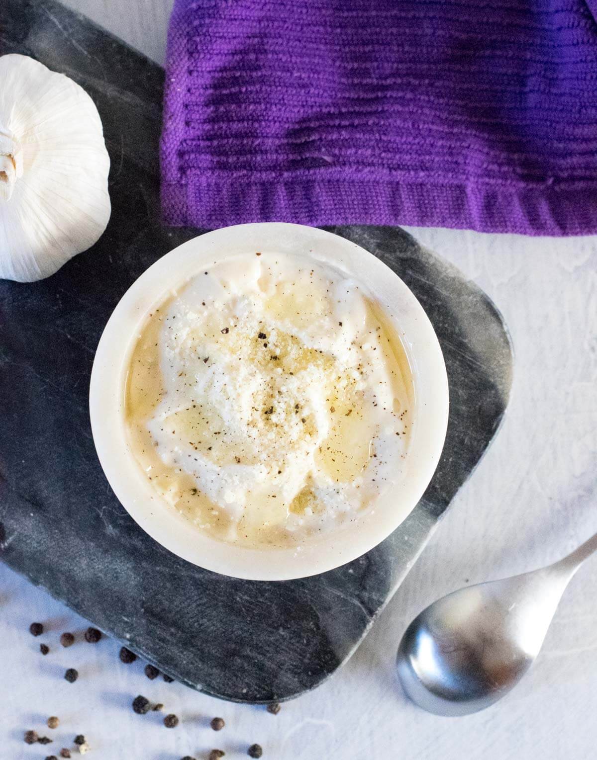 Serving truffle mayo with grated Parmesan cheese.