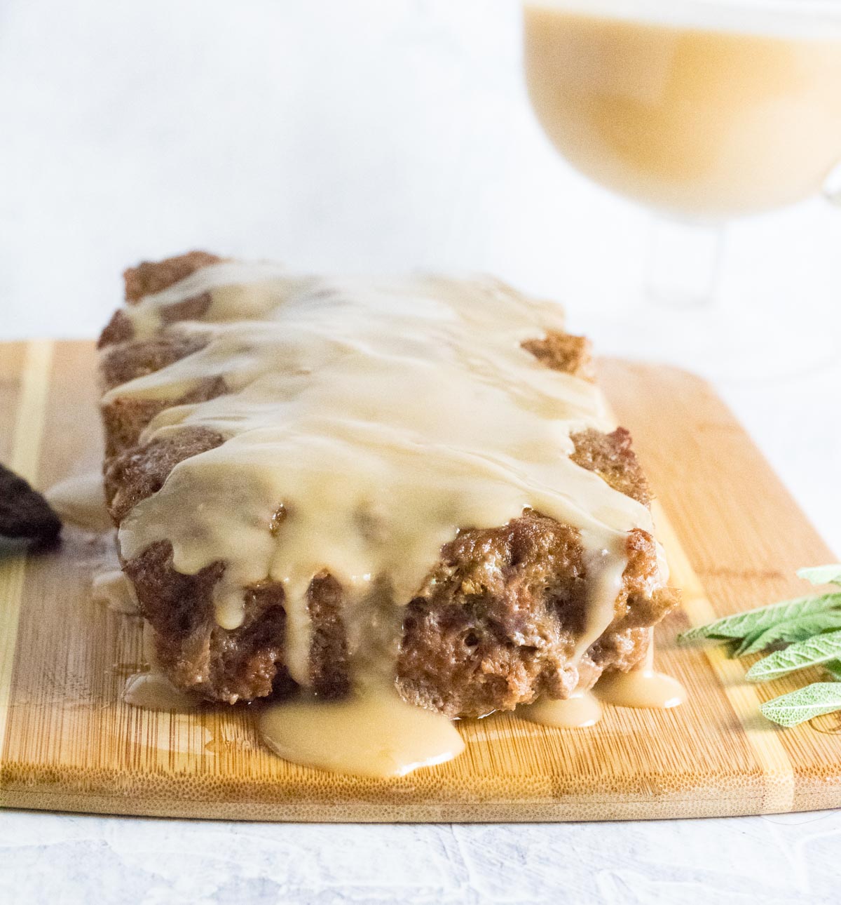 Meatloaf topped with brown gravy.