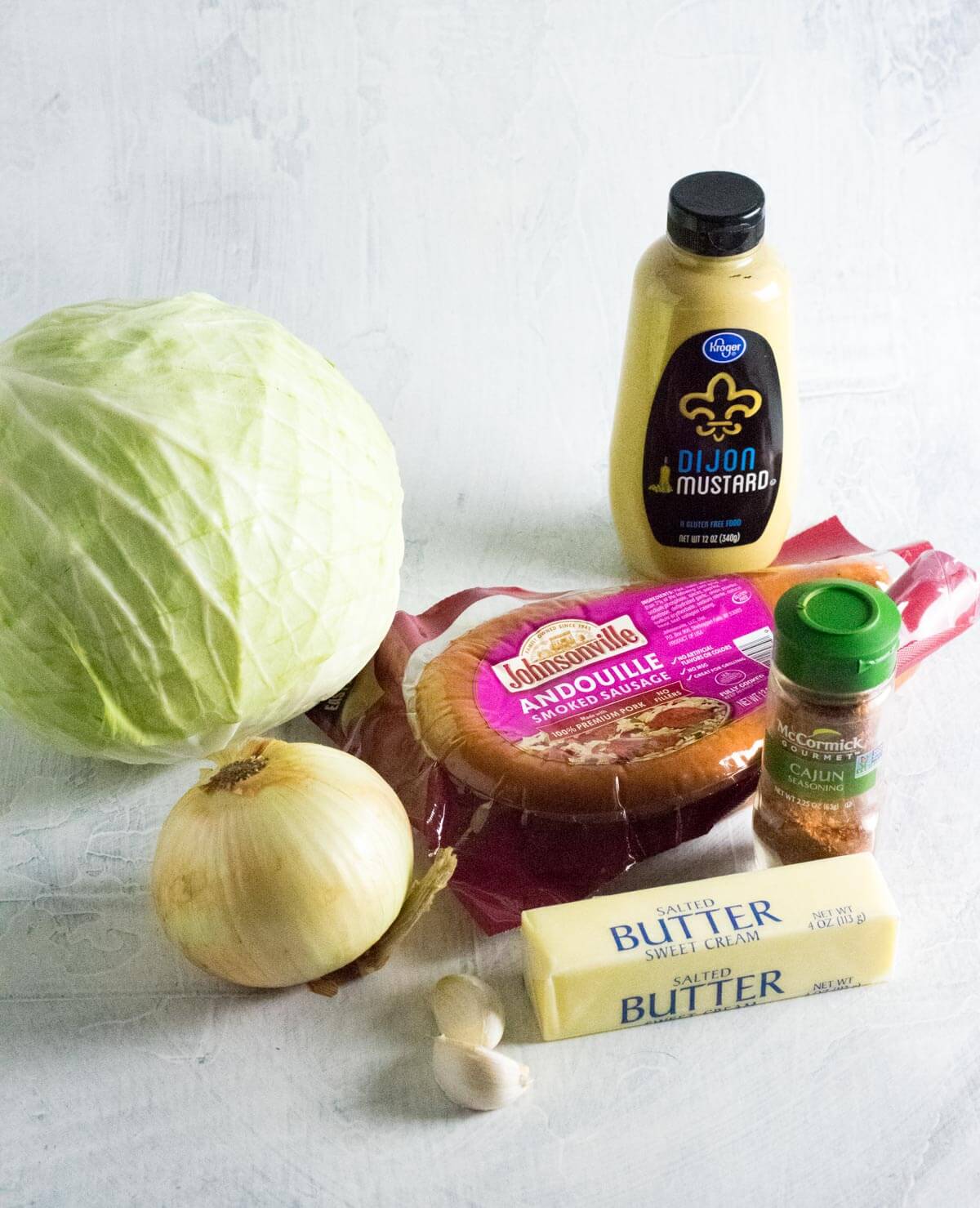 Showing fried cabbage with sausage ingredients.