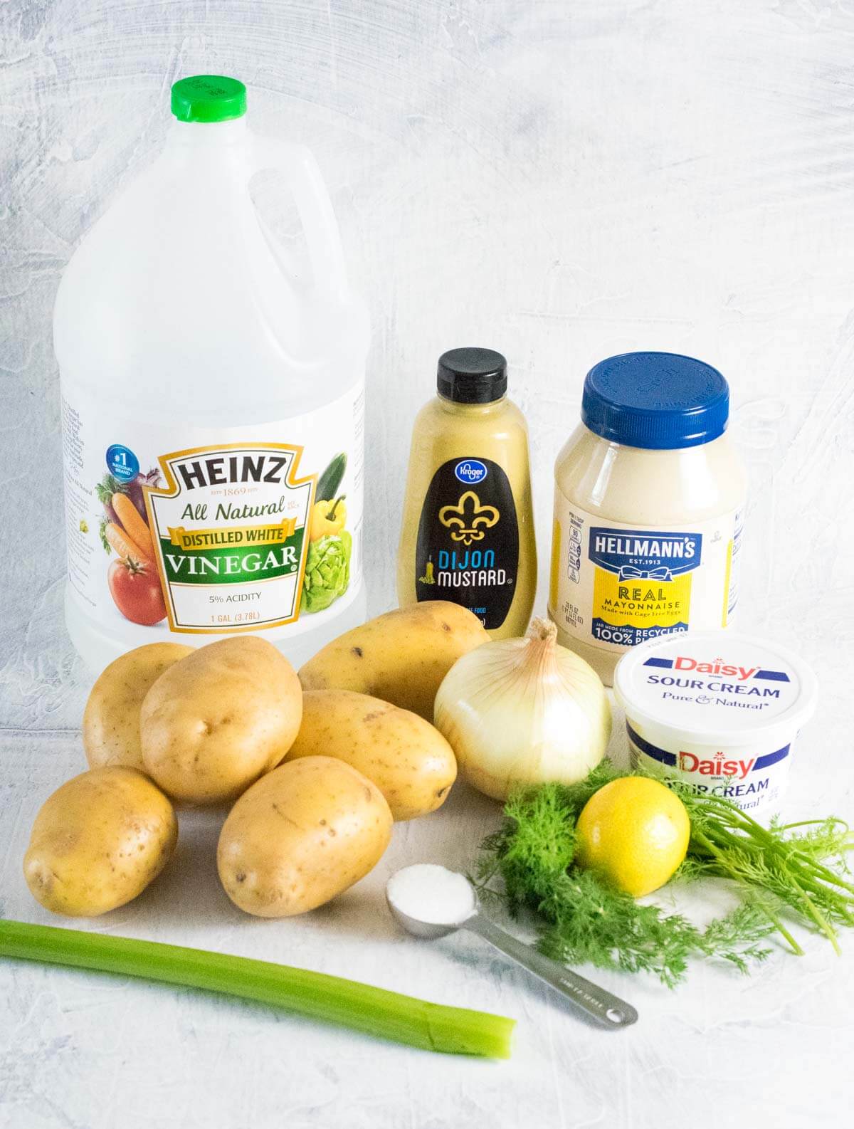 Showing ingredients for potato salad with dill.