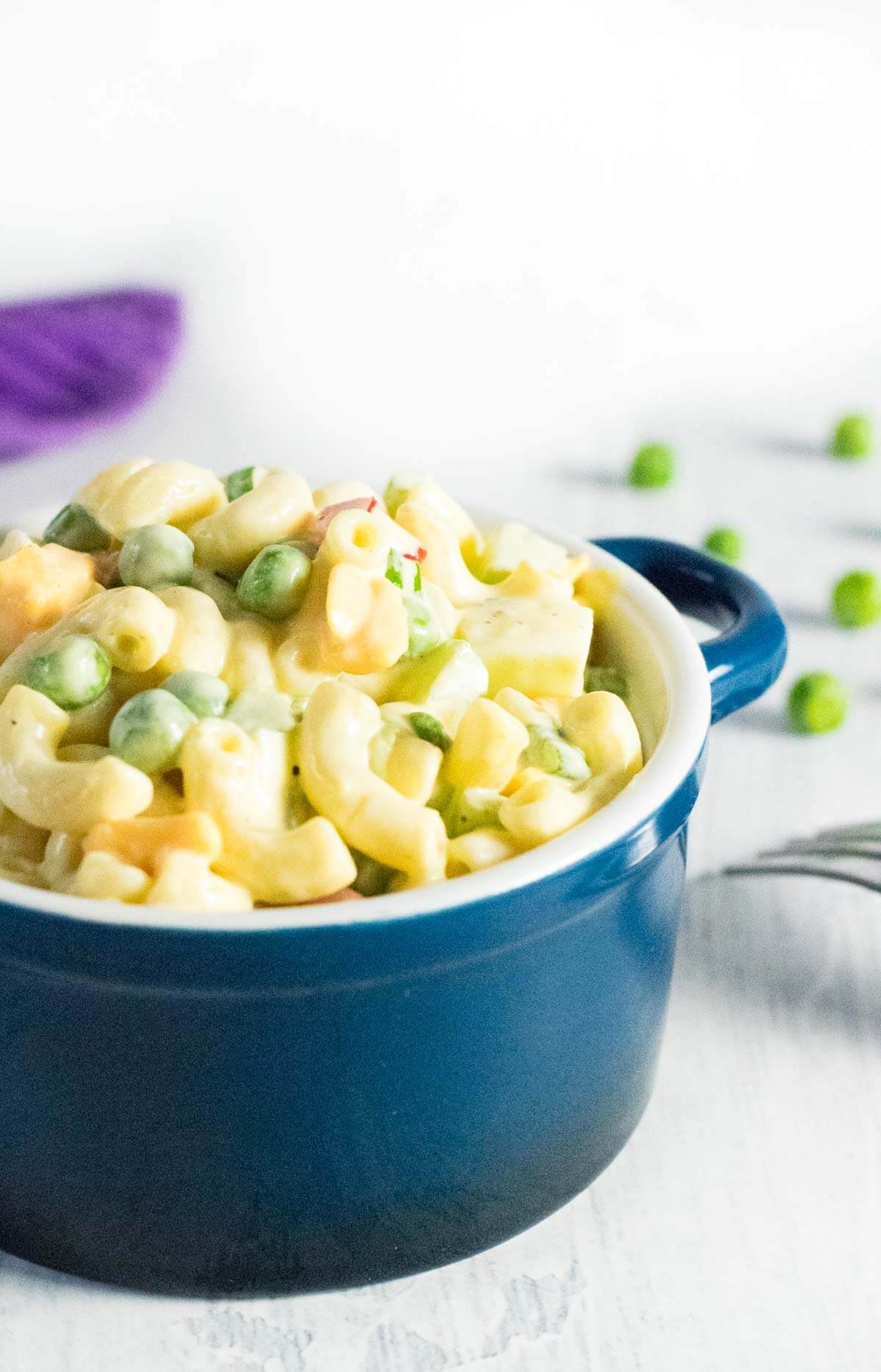 Serving Macaroni Salad with Peas.