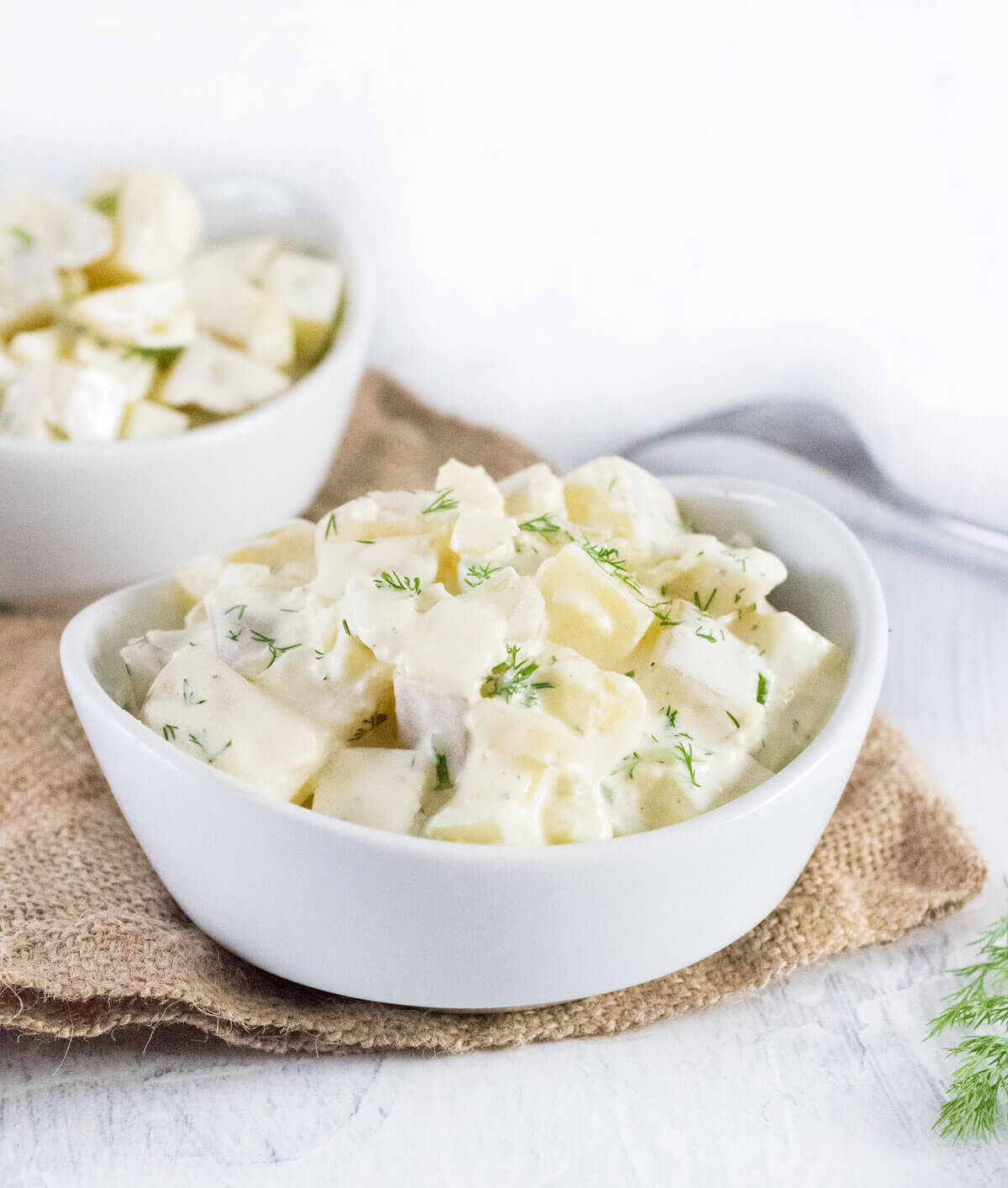 Serving potato salad with dill.