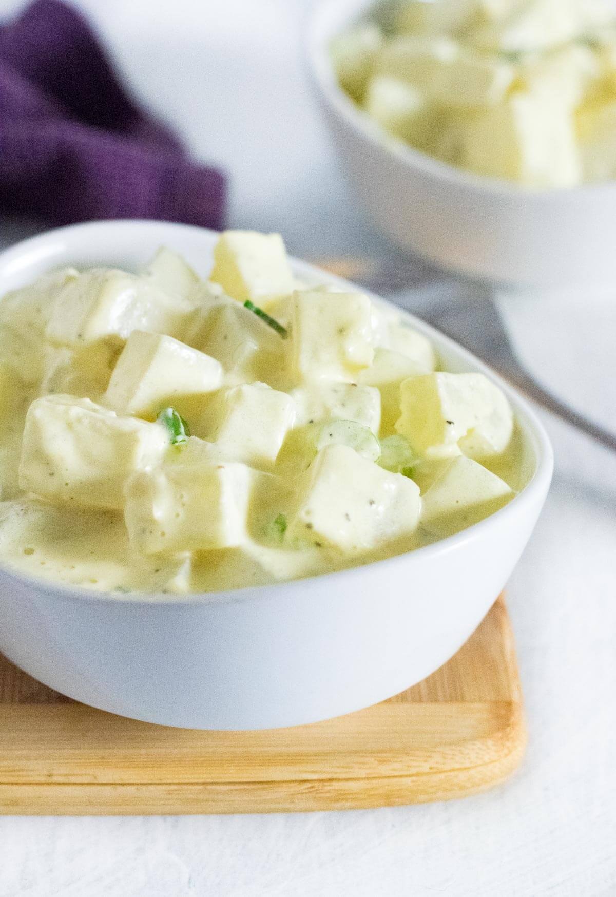 Serving potato salad with sour cream.