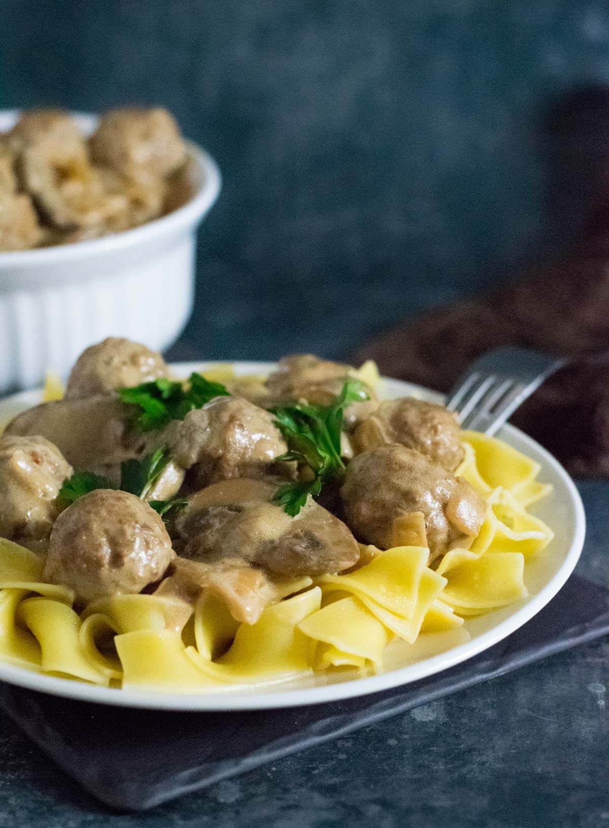 Serving stroganoff with meatballs.