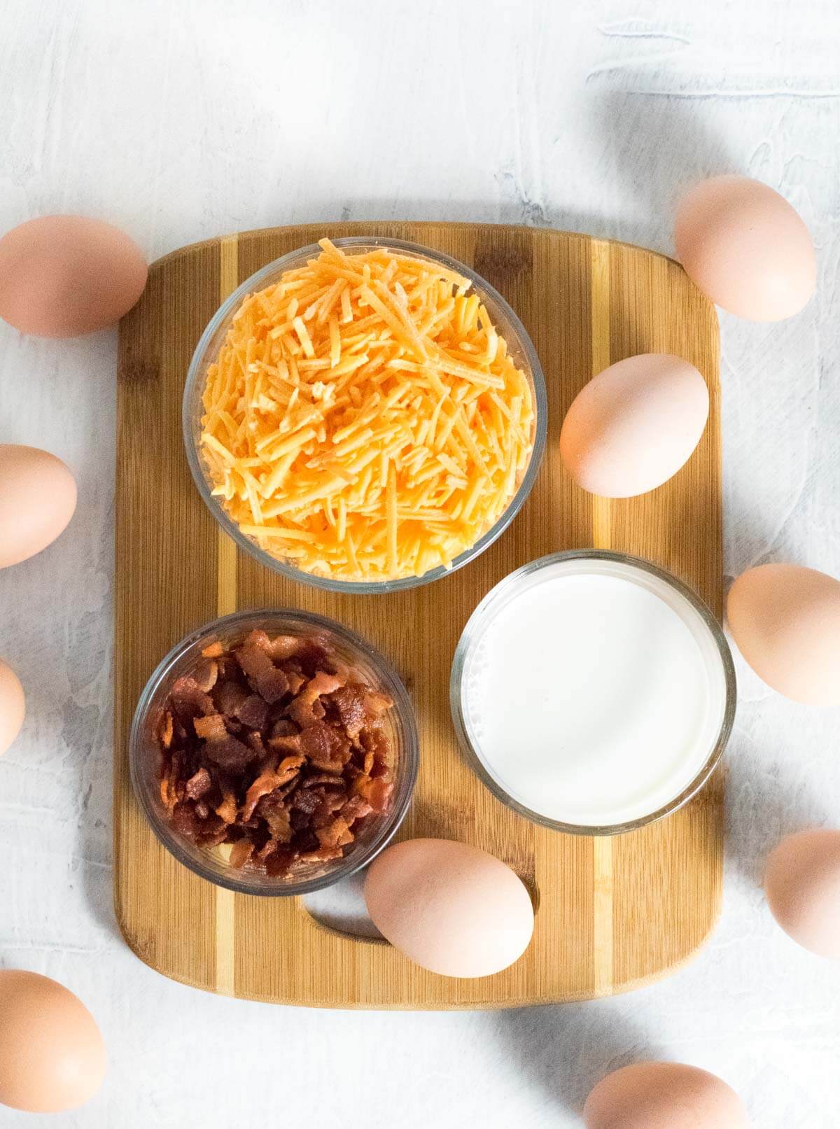 Showing cheesy bacon egg muffins ingredients.