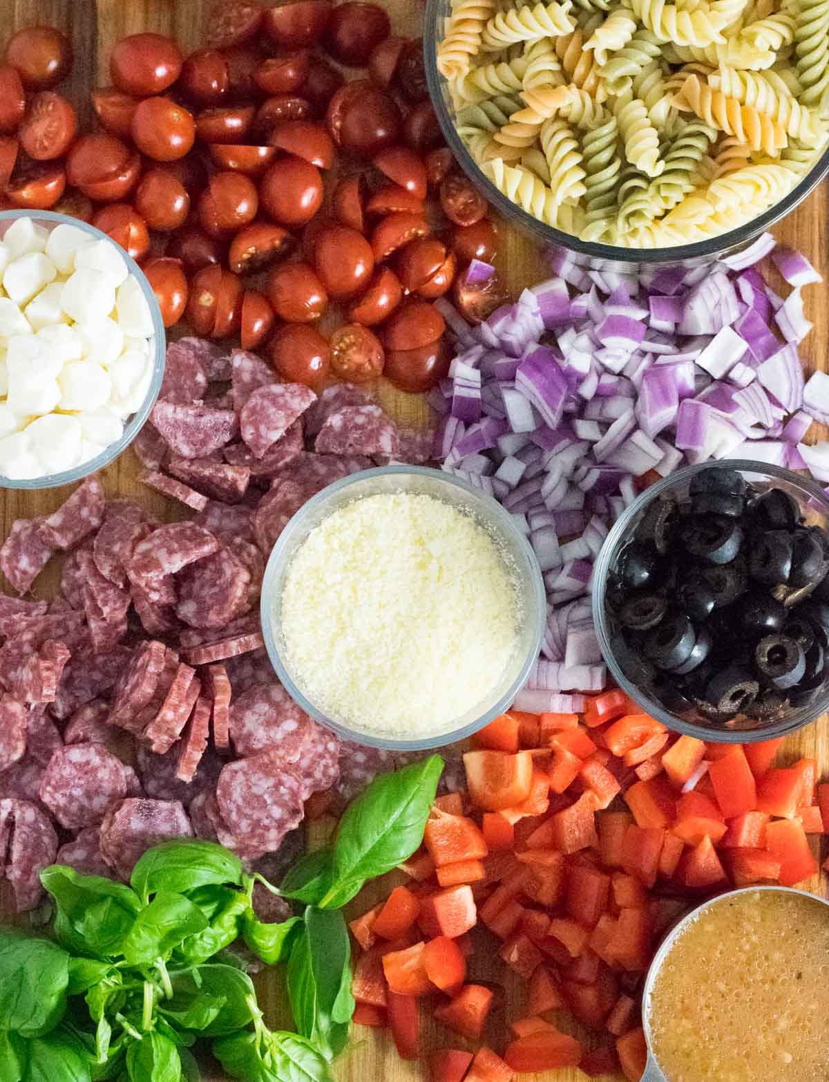 Cold pasta salad ingredients with Italian dressing.