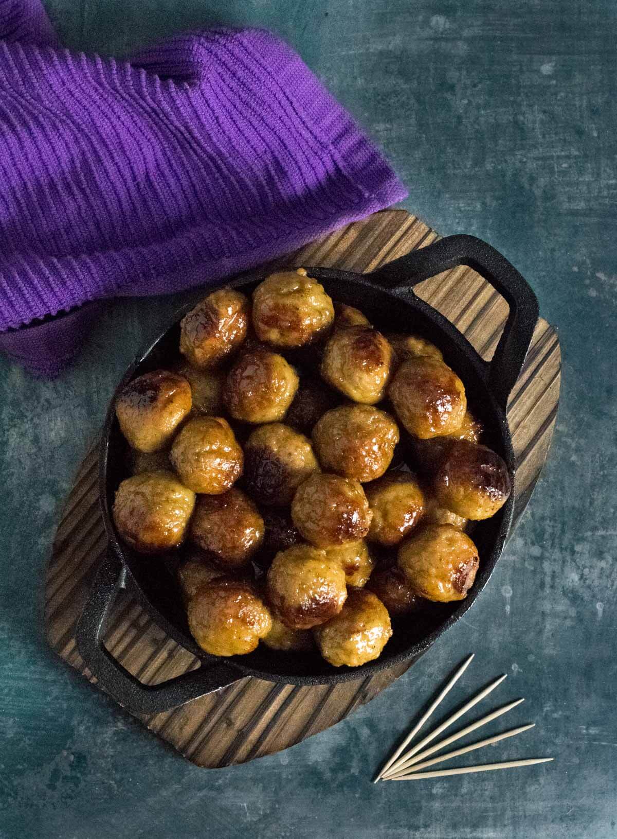 Serving hot honey meatballs.