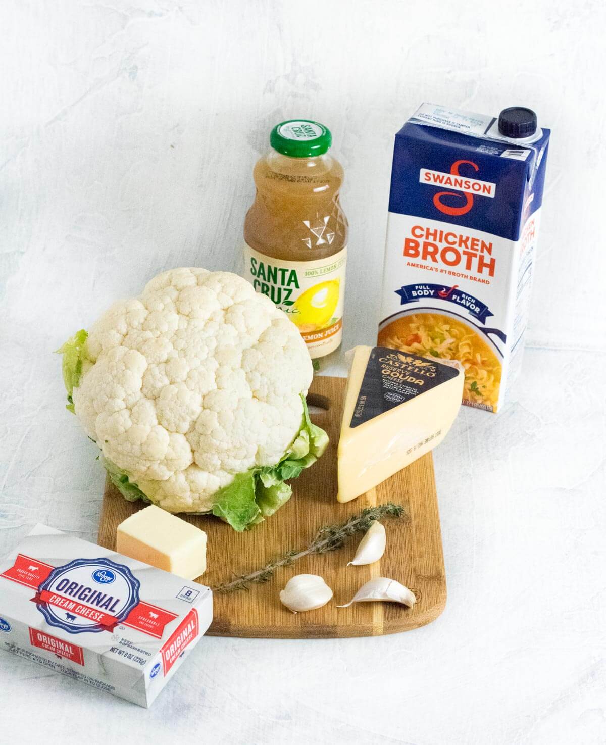 Cauliflower soup ingredients with cream cheese.