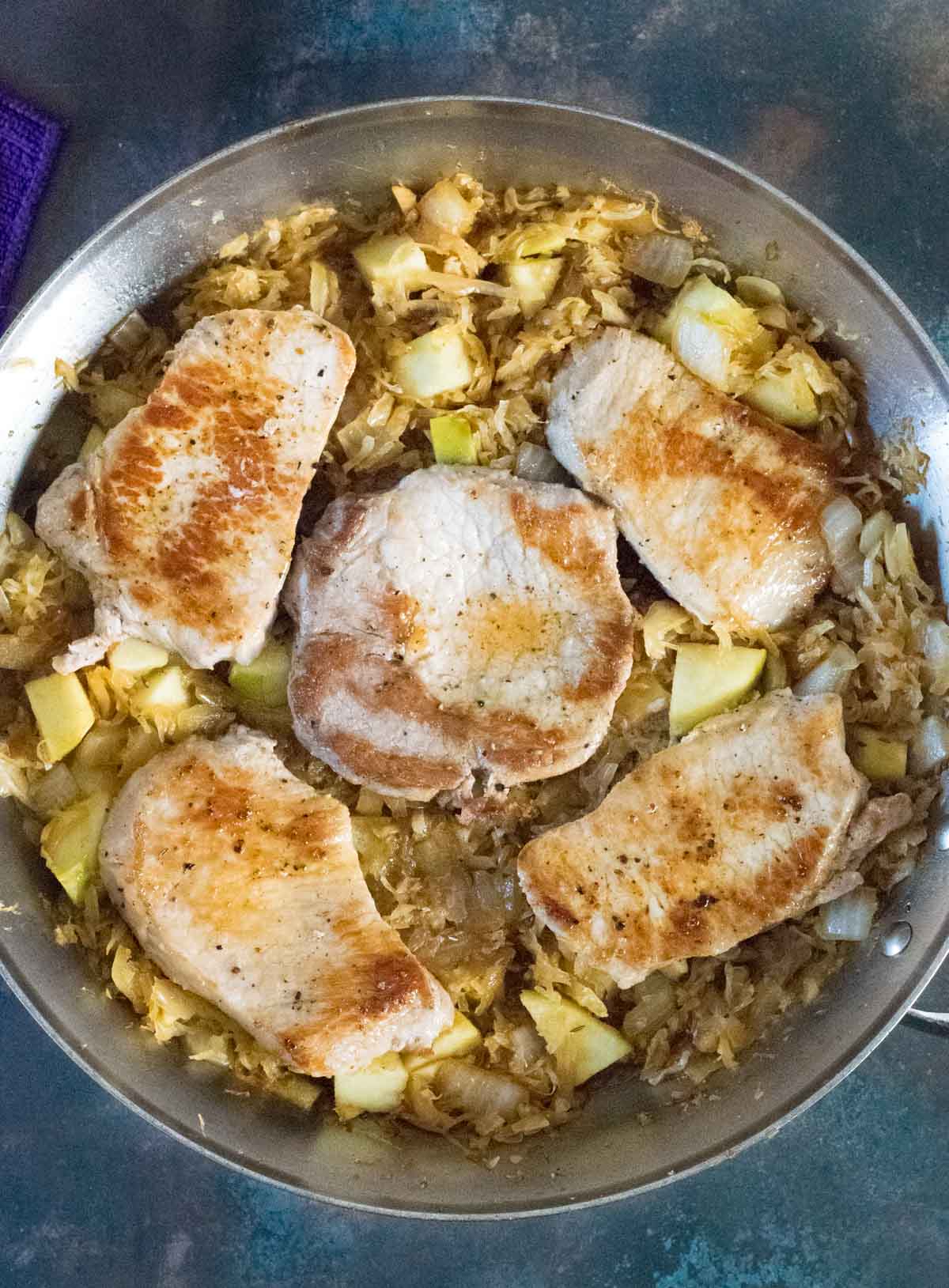 Making pork chops and sauerkraut.