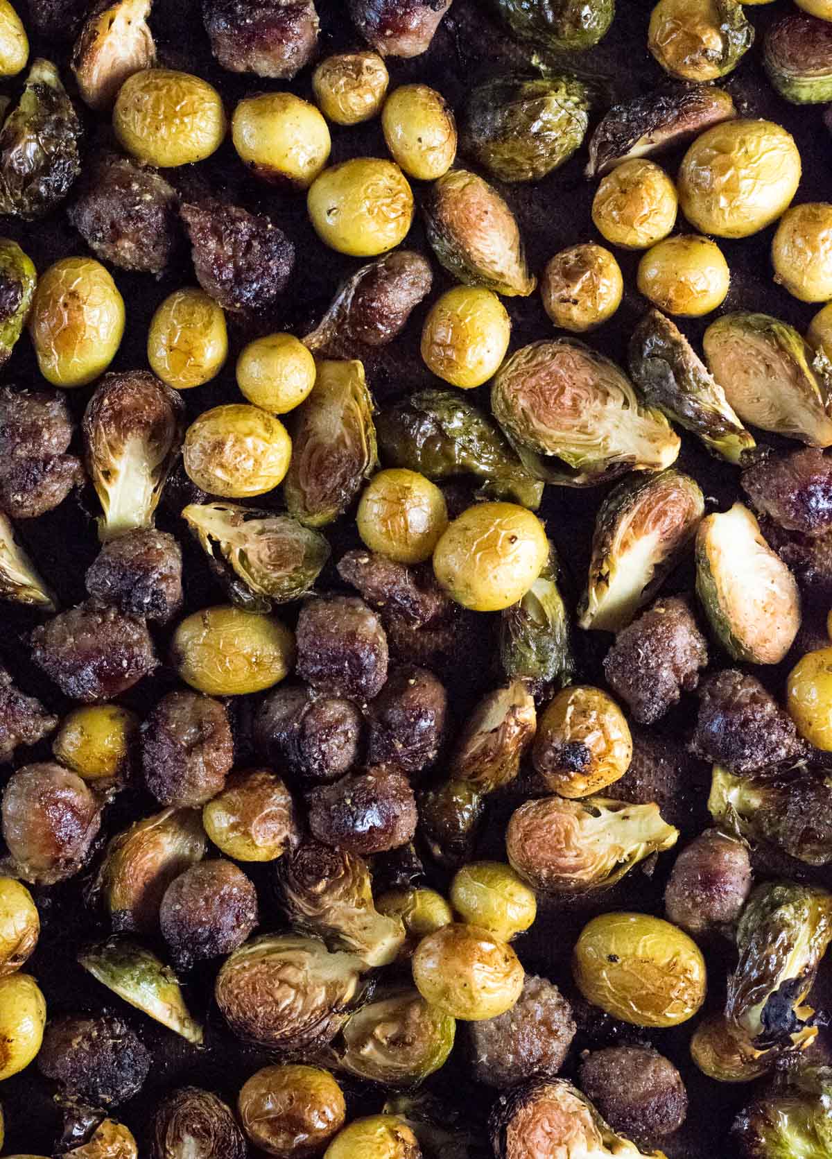 Brussels sprouts and sausage on sheet pan.