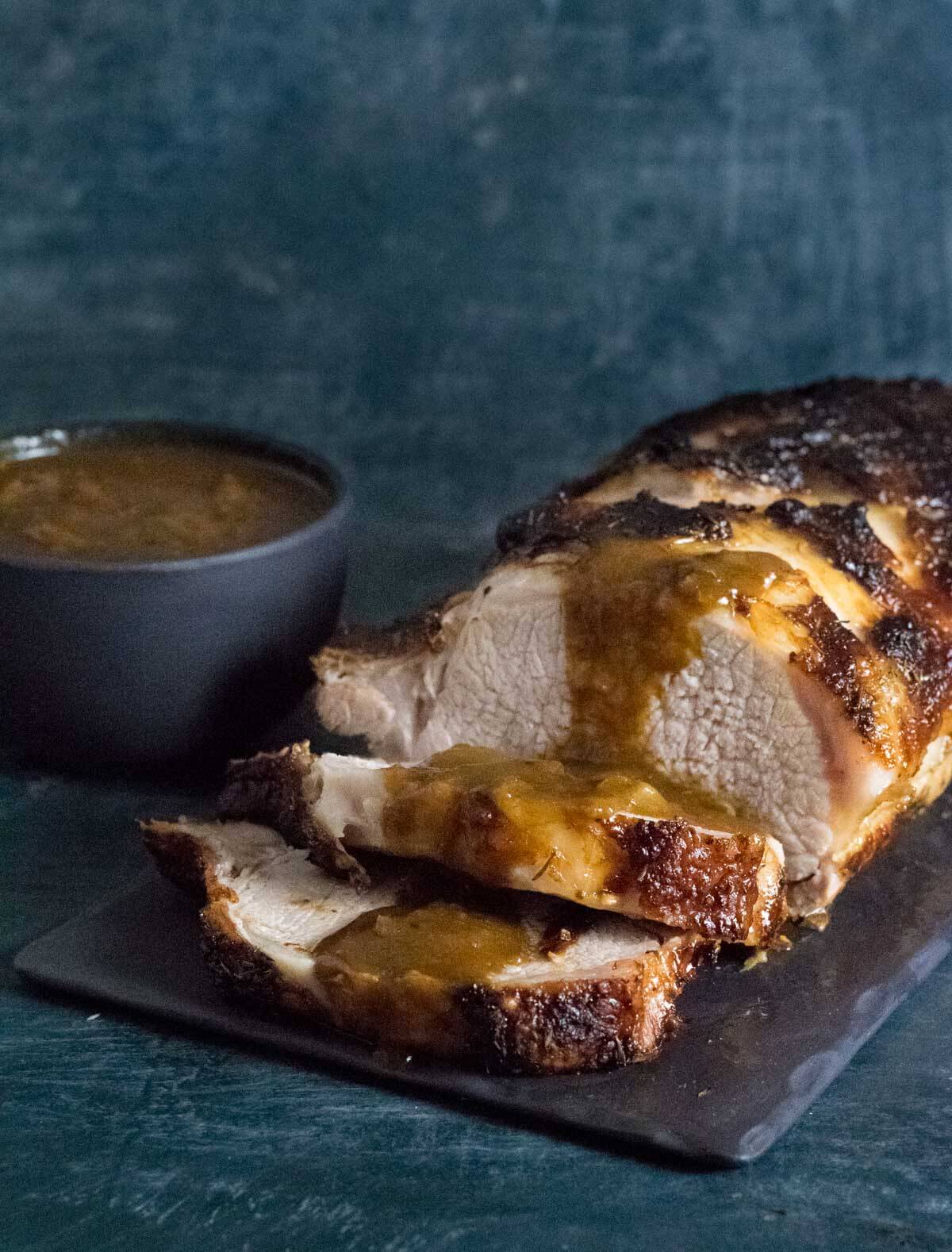 Roasted pork loin with gravy.