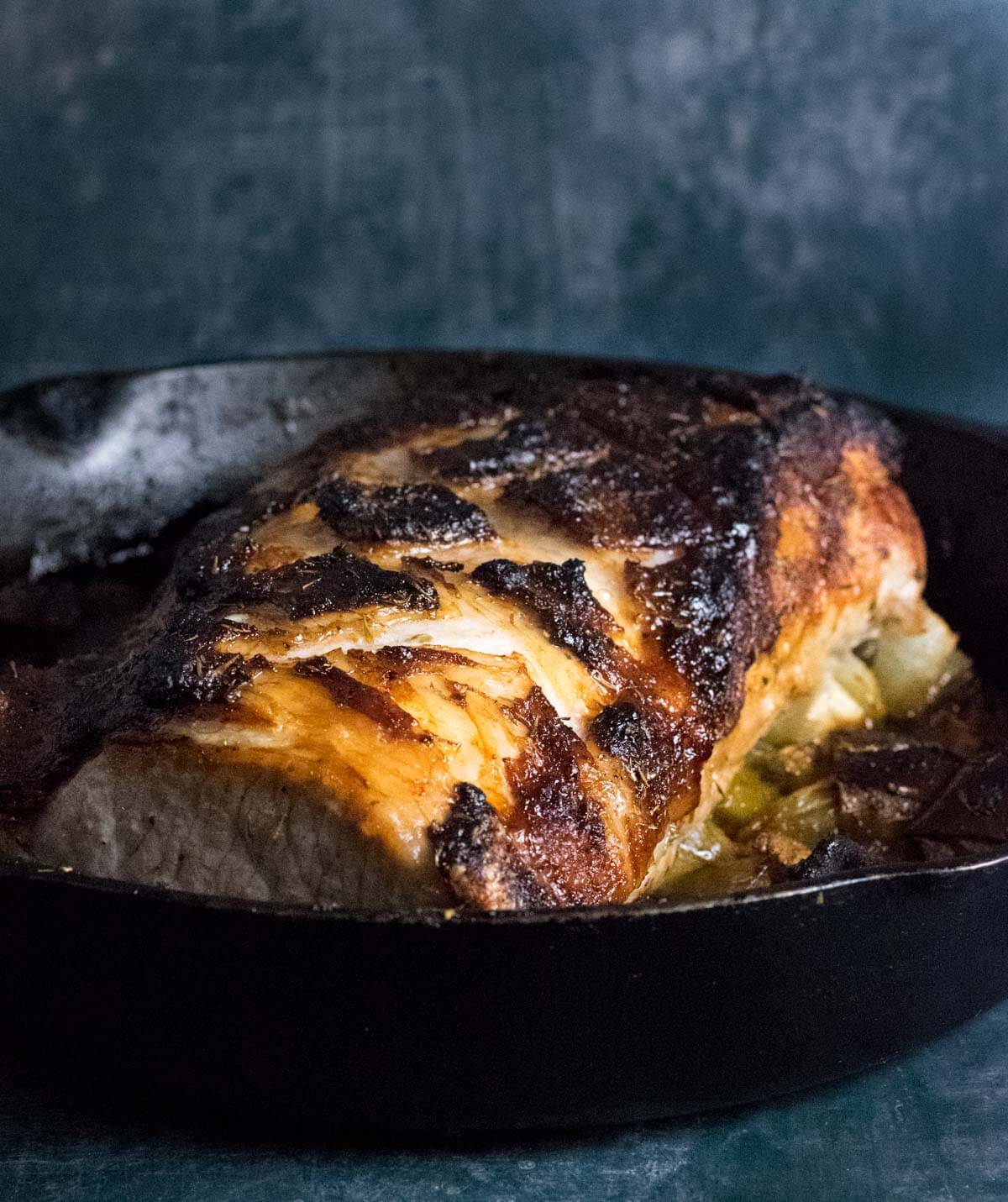 Roasted pork loin in roasting pan.