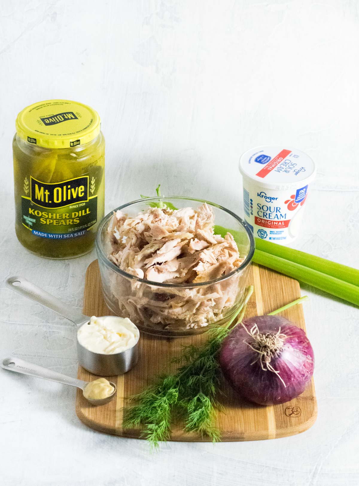 Dill pickle chicken salad ingredients shown.